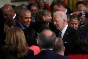 FILE PHOTO: U.S. President Biden and former U.S. President Obama speak about the Affordable Care Act and Medicaid at the White House