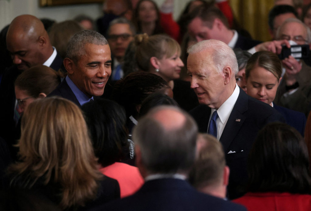 FILE PHOTO: U.S. President Biden and former U.S. President Obama speak about the Affordable Care Act and Medicaid at the White House