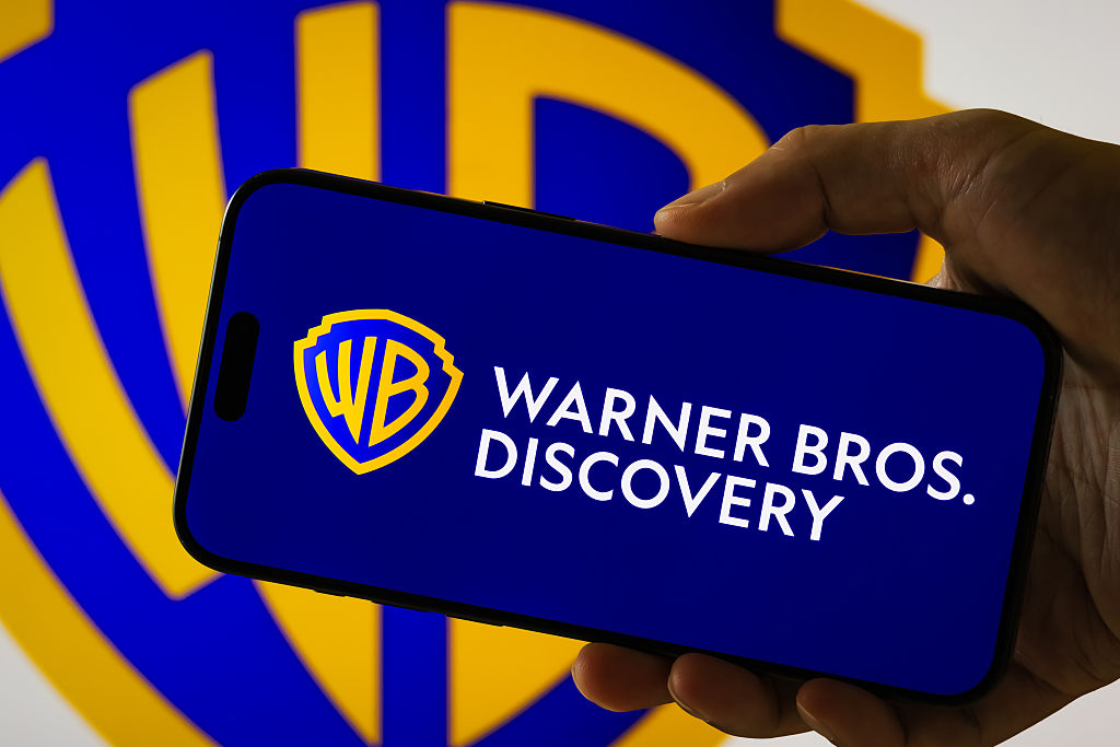 Warner Bros. Discovery logo displayed on smartphone screen