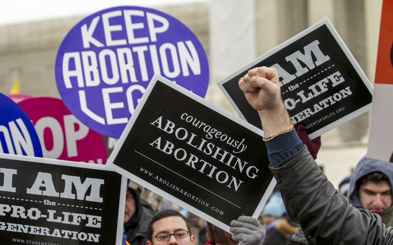 Opposing sides of abortion issue collide in front of Supreme Court building in Washington