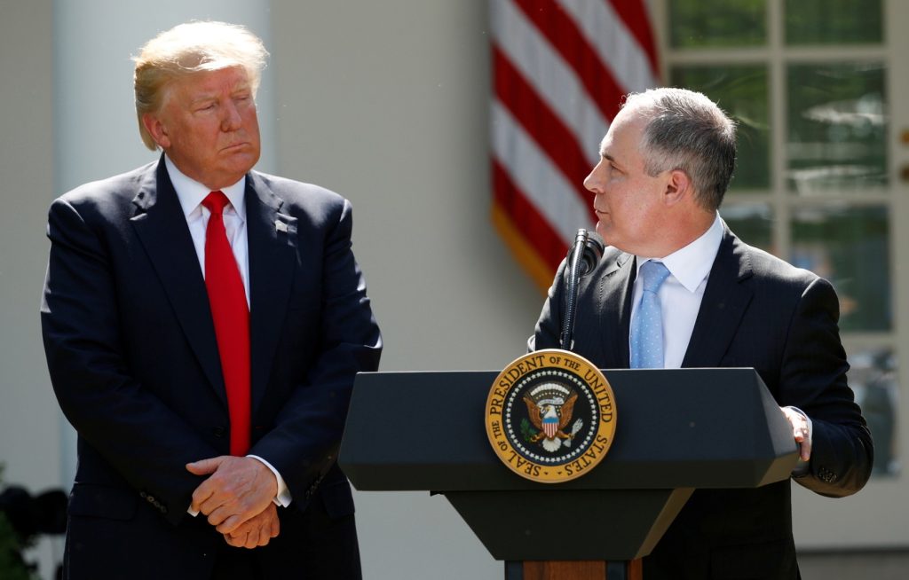 U.S. President Trump listens to EPA Administrator Pruitt after announcing decision to withdraw from Paris Climate Agreement in the White House Rose Garden in Washington
