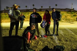 CBP agents detain and transport migrants.