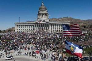 People participate in a protest, in a demonstration that is part of larger "Hands off" events organized nationwide against U.S. President Trump, in Salt Lake City